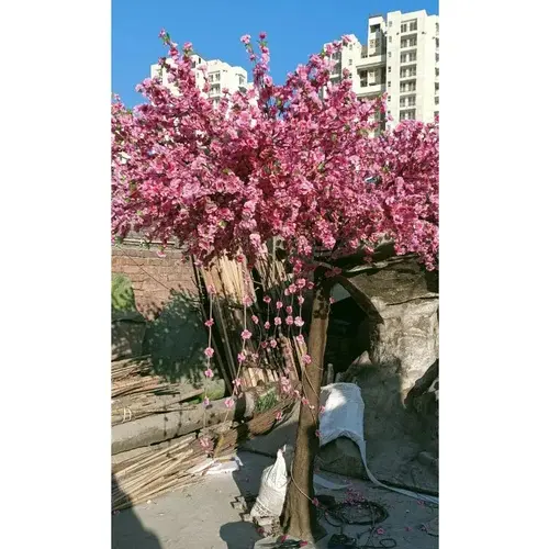 One sided artificial pink blossom tree