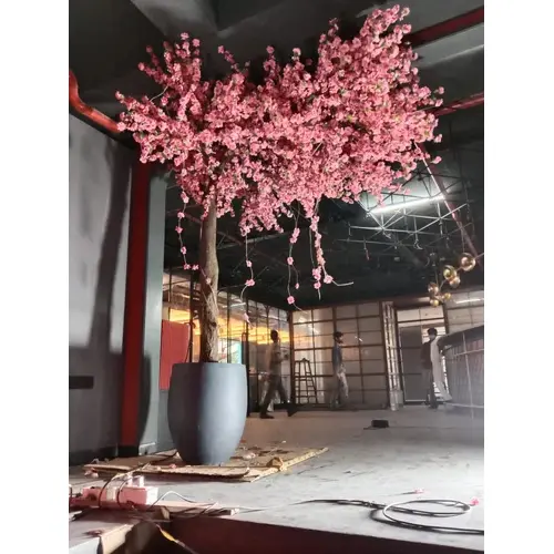 One sided artificial pink blossom tree