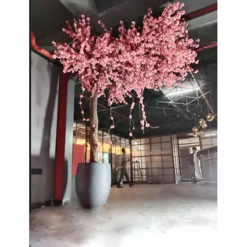 One sided artificial pink blossom tree